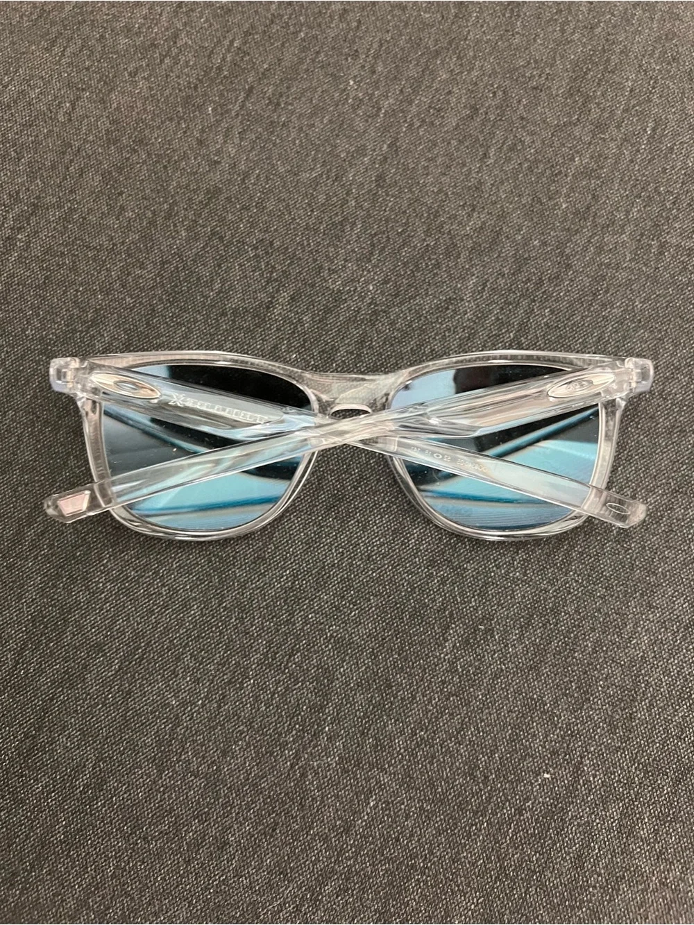 Oakley Clear Frame Sunglasses with Bright Blue Mirrored Lenses